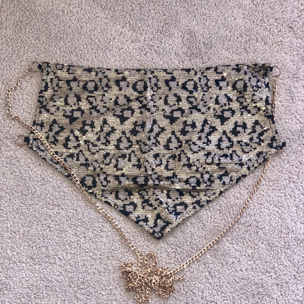 Revolve backless chain top